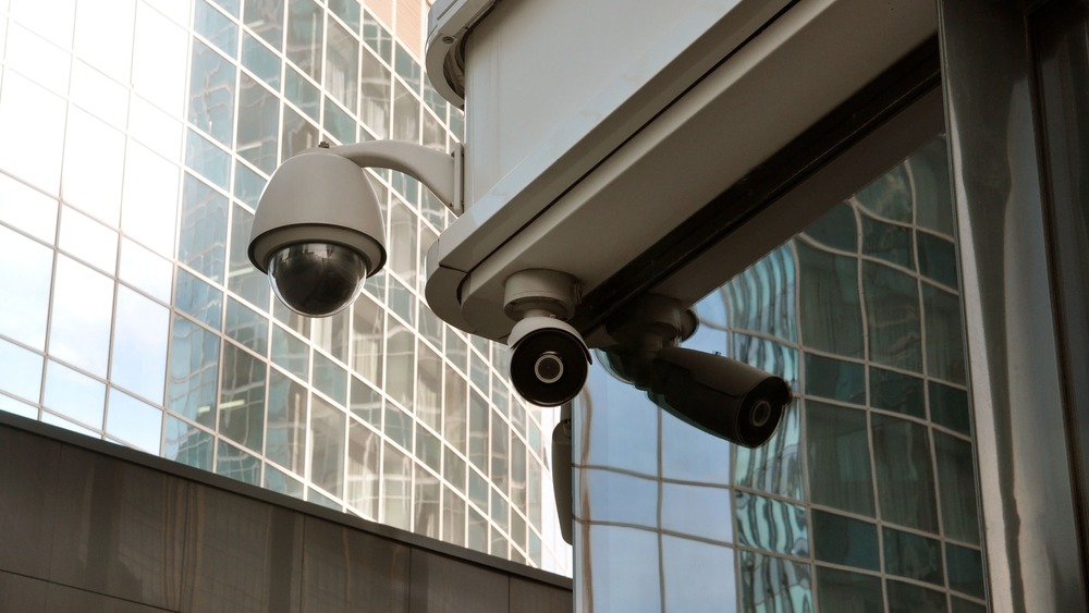 Cctv,Cameras,On,The,Background,Of,The,Modern,City.,Safety